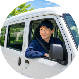 配送車両に乗るドライバー